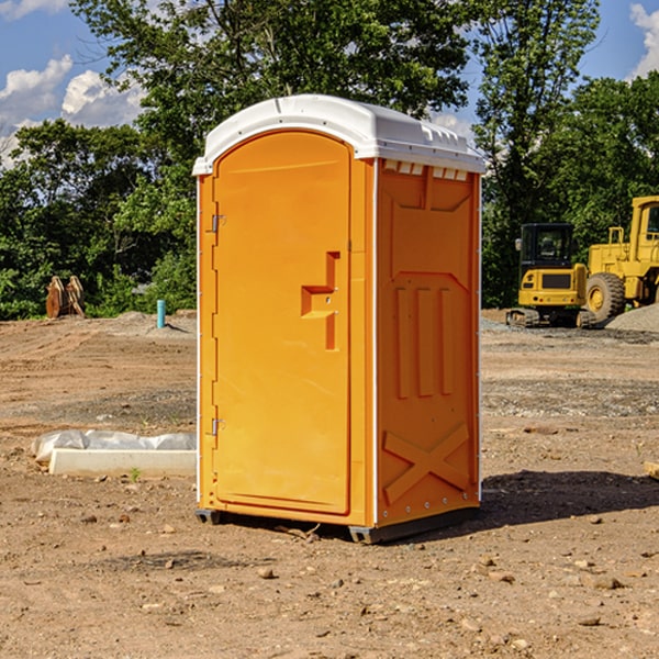 what is the cost difference between standard and deluxe portable toilet rentals in Adams County